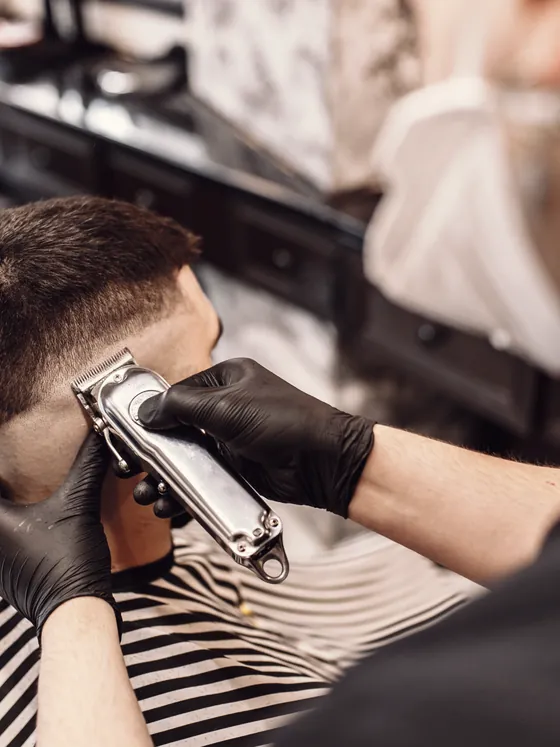 Clipper work through a fade at the back of the head.