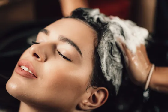 Client's hair being shampooed at the basin.