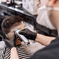 Men's beauty salon. Men's haircut in a barbershop. New haircut style 2020